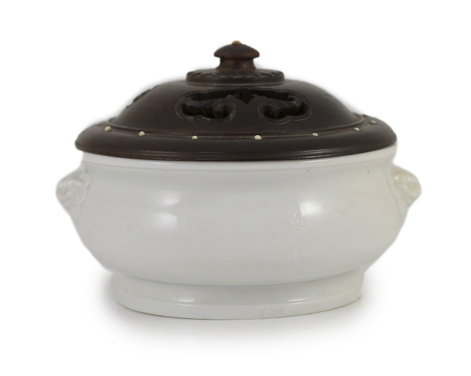A Chinese blanc-de-chine inscribed censer, Dehua kilns, Kangxi period, 15 cm wide, later wood cover, small to chip to edge of foot